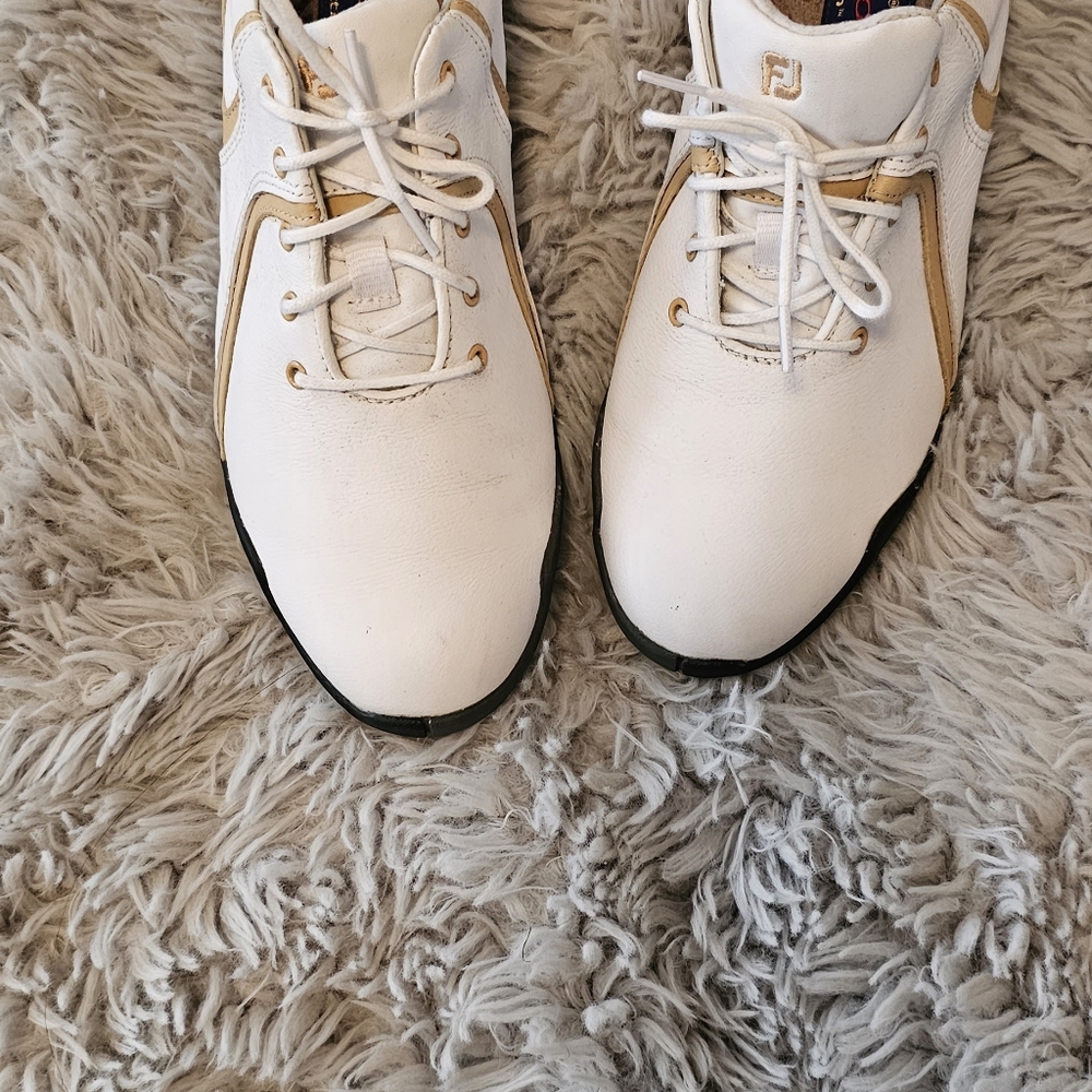 Ladies white with beige detail  footjoy golf shoes, with cleats in size 7.